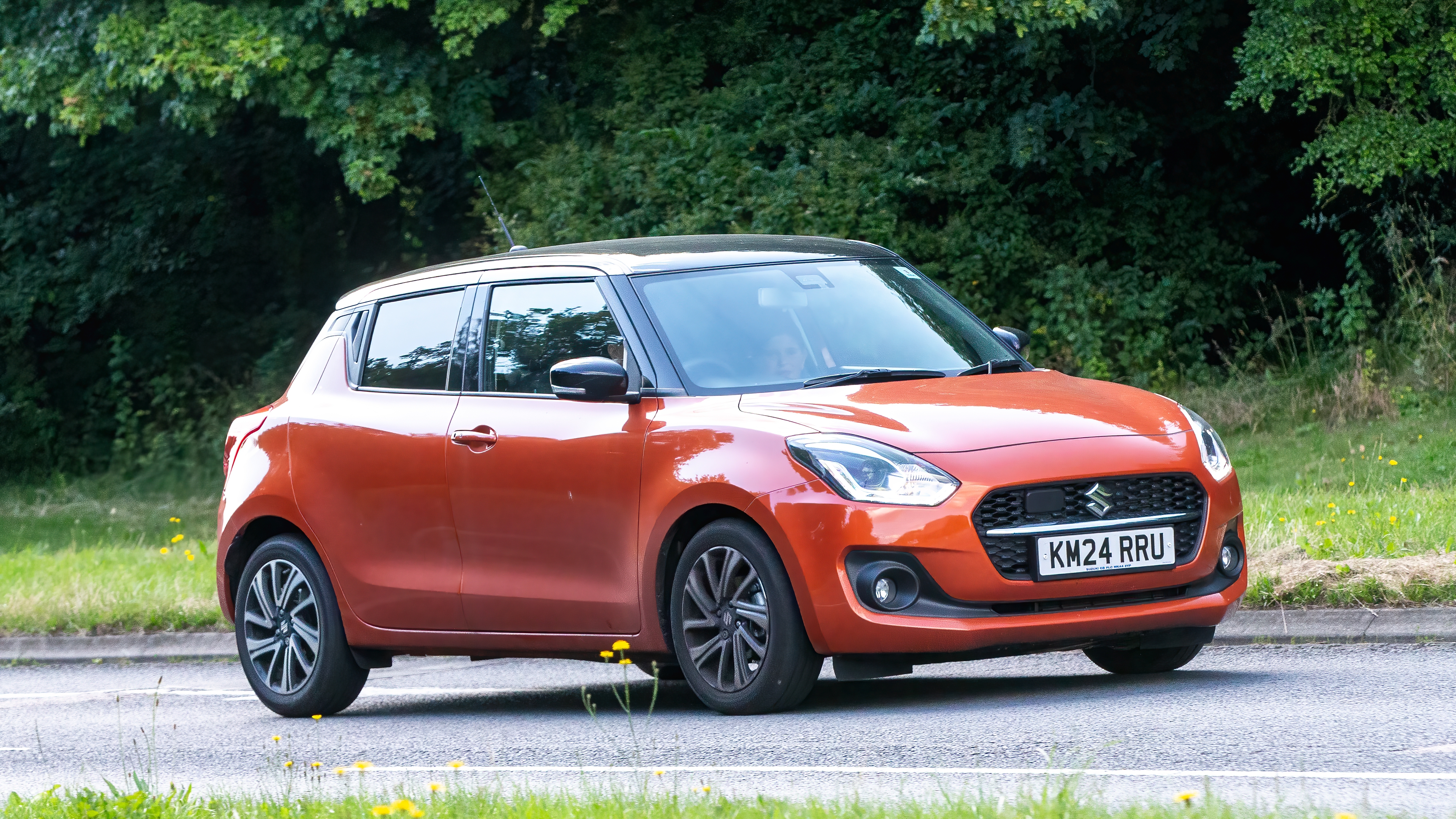 Orange Suzuki Swift Hybrid.jpg